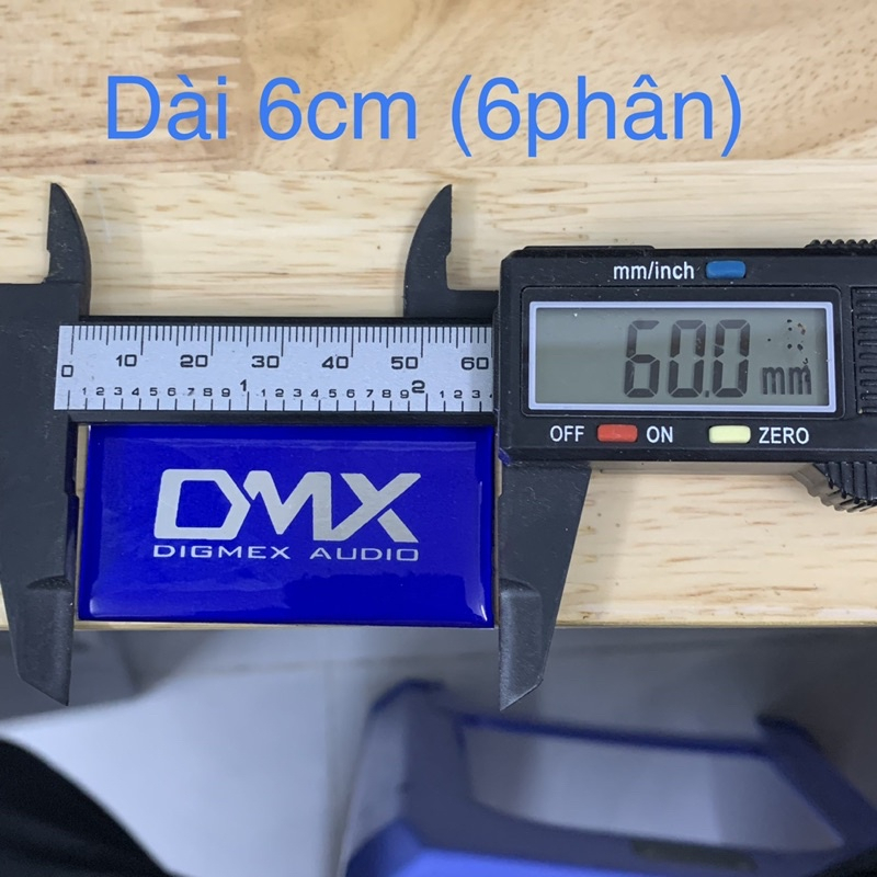 Tem logo DMX, giá 2 cái, kích thước 6cm x 3cm.