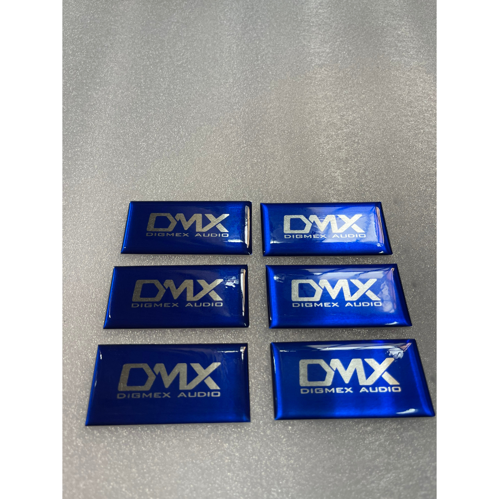 Tem logo DMX, giá 2 cái, kích thước 6cm x 3cm.