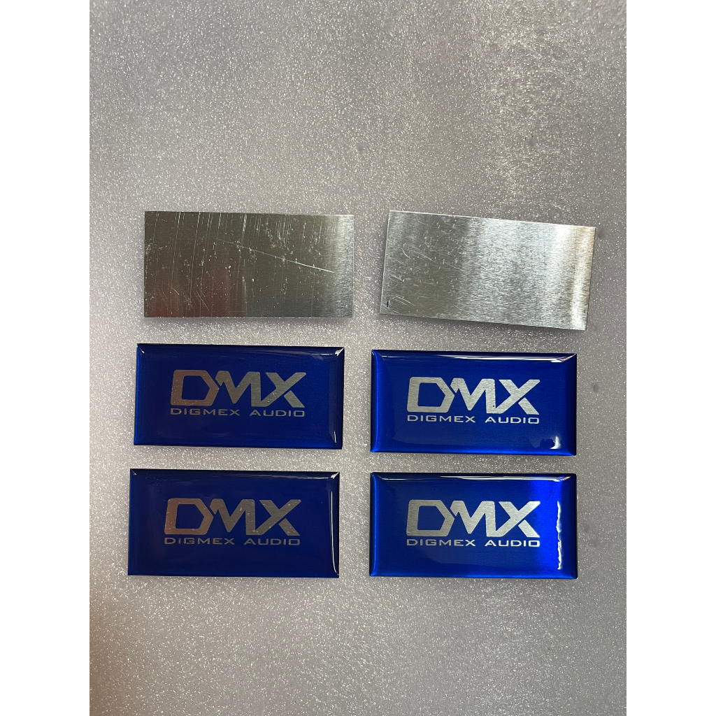Tem logo DMX, giá 2 cái, kích thước 6cm x 3cm.