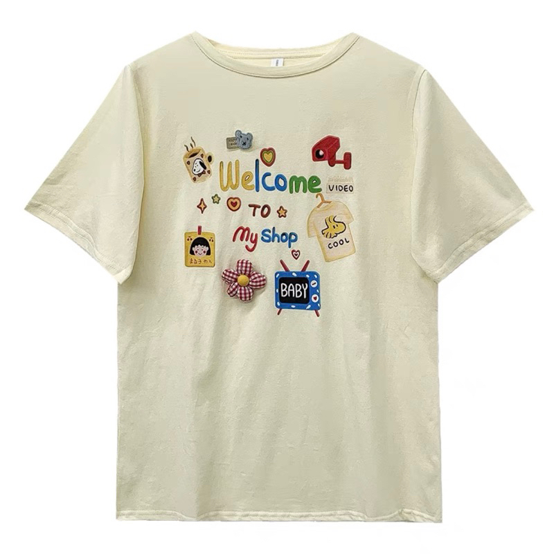 Áo Phông Chibi Baby Welcome To My Shop Dễ Thương Màu Be Vàng
