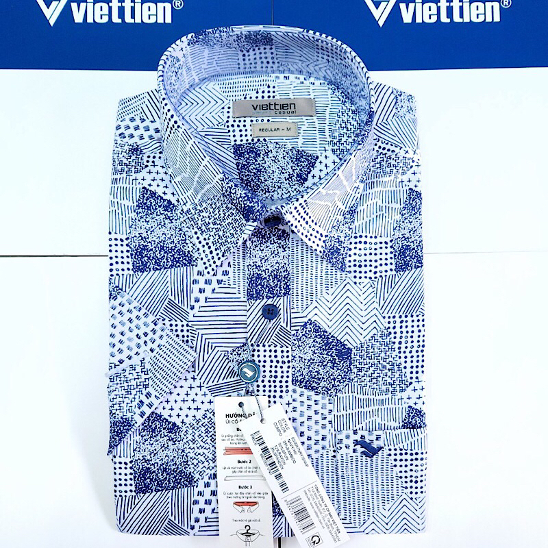 Áo sơ mi tay ngắn vạt ngang việt tiến hoạ tiết xanh