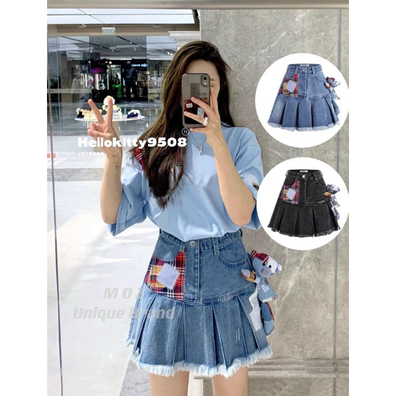 Chân váy jeans 13de marzo xếp ly đính gấu bông đáp vải kẻ đỏ