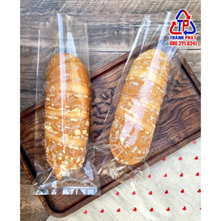 Túi in hình đựng bánh mì dài 30cm x 12cm -  túi đựng đế bạc 3220 - túi bánh ngọt các loại ( 1kg)