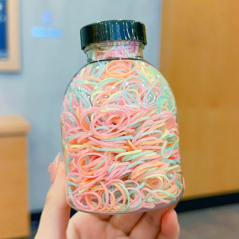 Set 1000 Thun Cột Tóc Co Giãn Nhiều Màu Kèm Bình Đựng