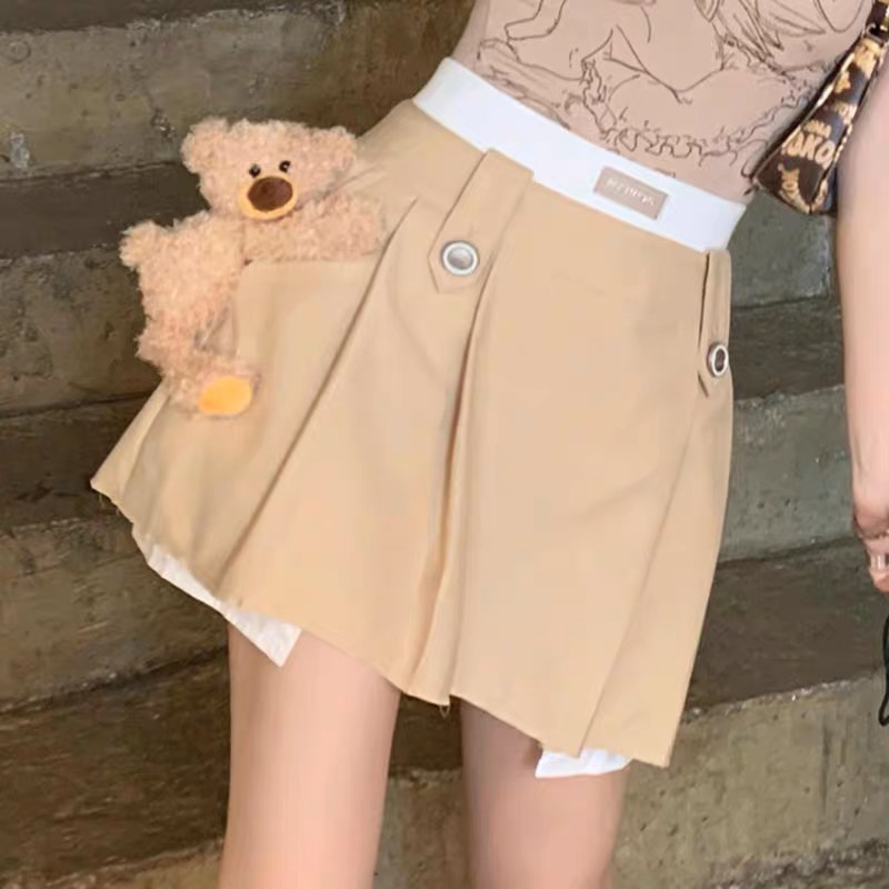 Chân váy 13de marzo nâu xếp ly phối trắng đính gấu bông