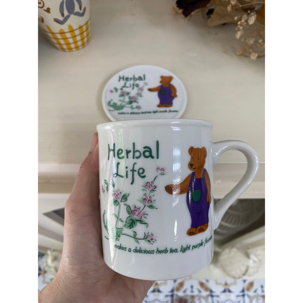 Cặp Ly sứ có nắp in Gấu Herbal Life