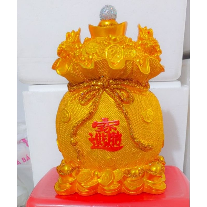 Túi vàng tiết kiệm tiền và nhẫn vàng