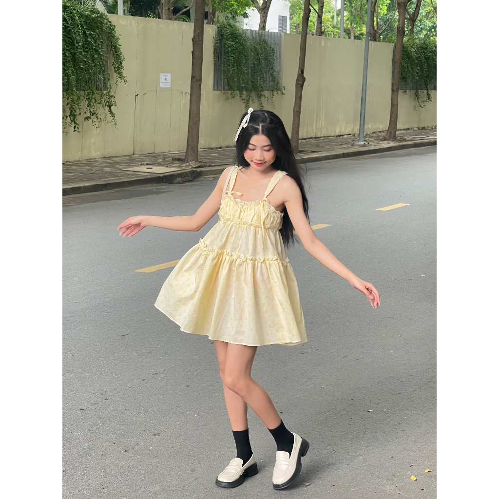Lolie Dress - đầm babydoll hai dây cột nơ chất gấm xốp in nổi