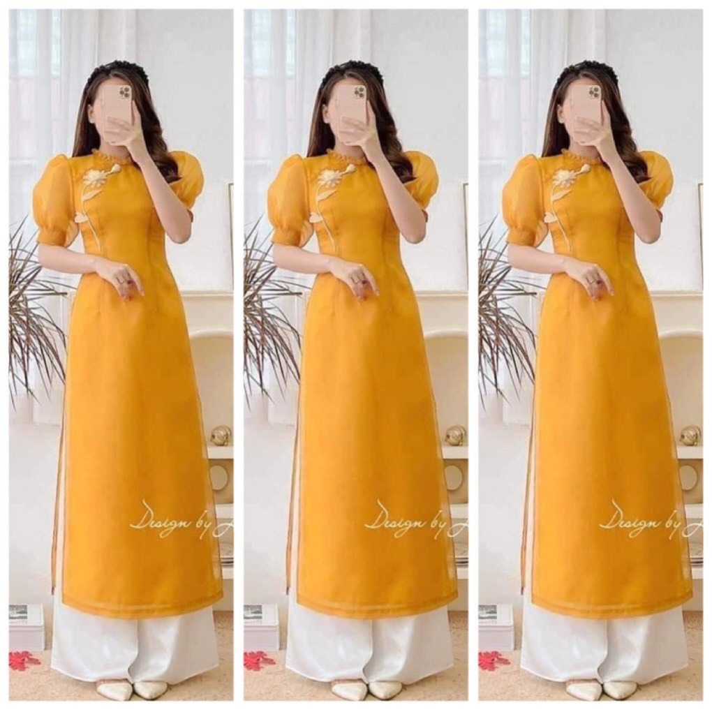 Áo Dài Cách Tân Màu Vàng, thiết kế vải voan tơ Cổ Xếp Ly, Vai Bồng, Đắp Hoa Trắng Điệu Đà Siêu Xinh Trước Ngực