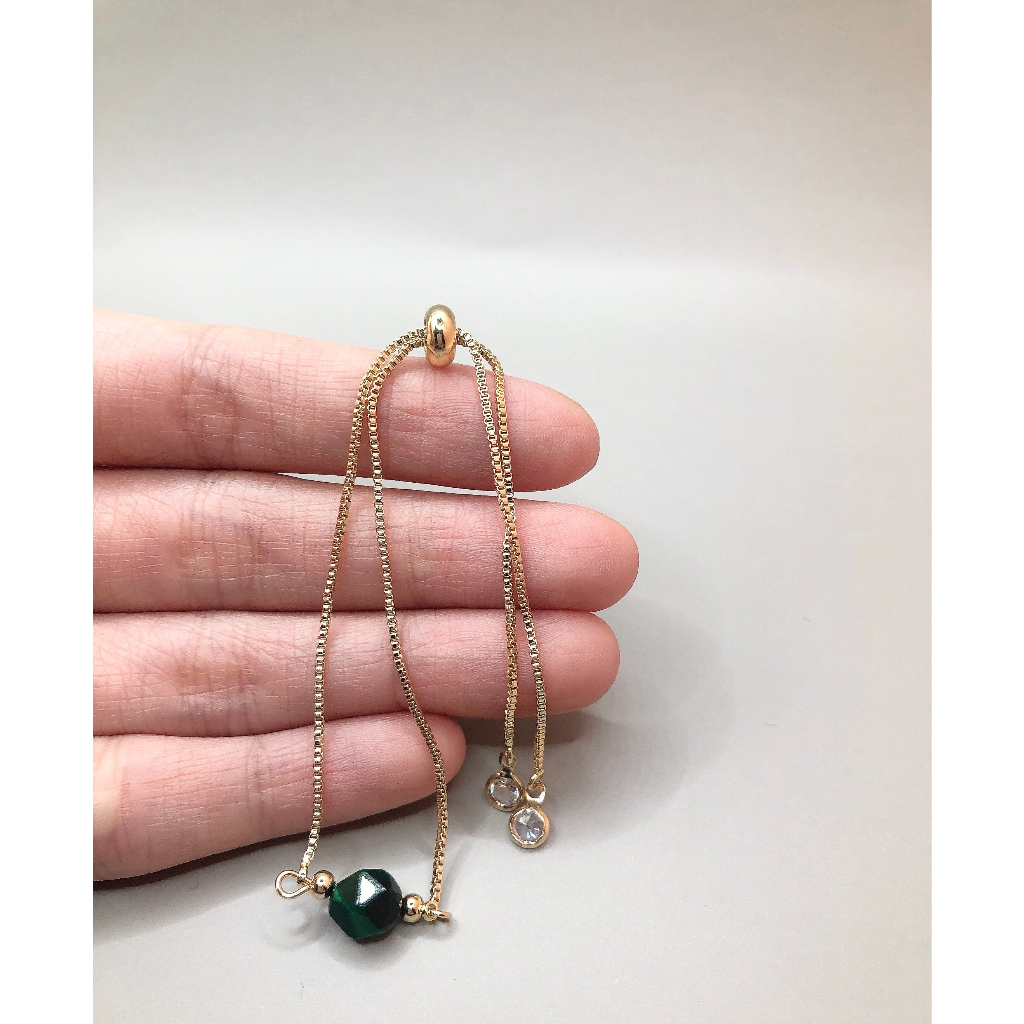 Vòng dây lụa rút đá mắt hổ xanh cắt giác 7mm si tuyển Nhật