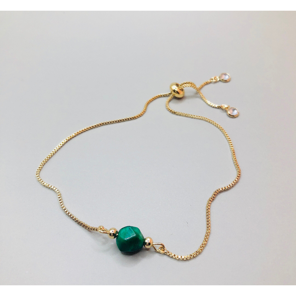 Vòng dây lụa rút đá mắt hổ xanh cắt giác 7mm si tuyển Nhật