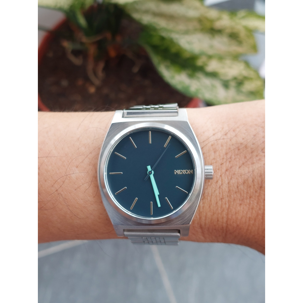 Đồng hồ nam Nixon mặt xanh dây thép chạy pin hàng Si