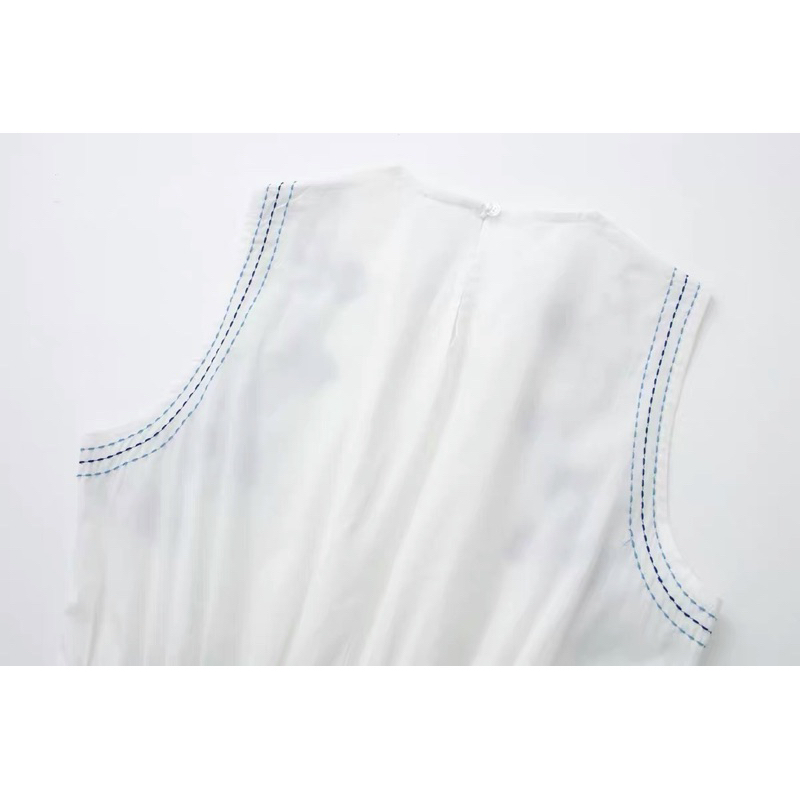 Đầm xoè trắng sát nách hoạ tiết xanh