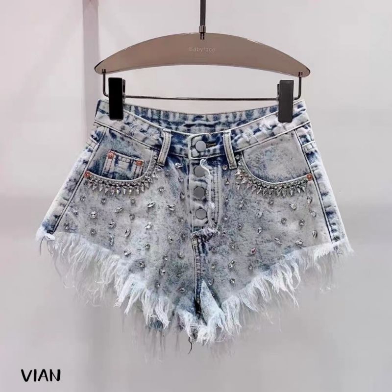Quần short jean đính đá tua rua gấu