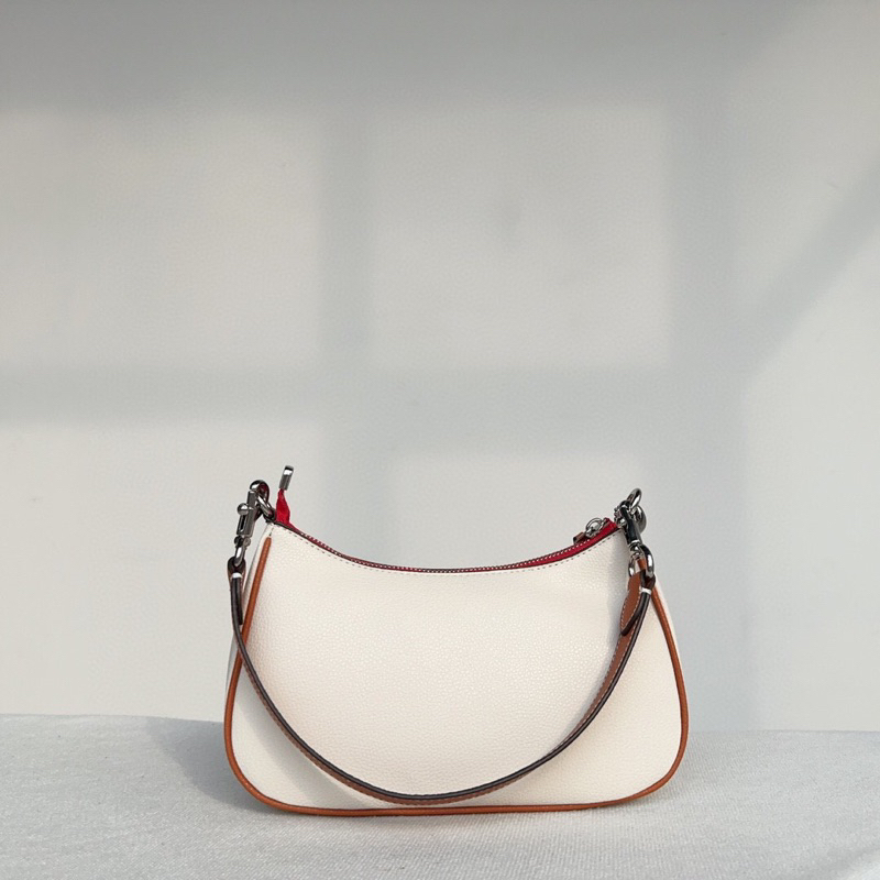 Túi kẹp nách dáng thuyền Coach Teri hoạ tiết sticker mới