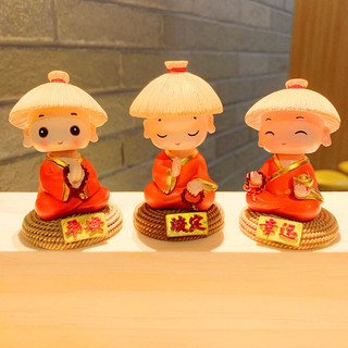 Bộ tượng chú tiểu áo cam đội nón