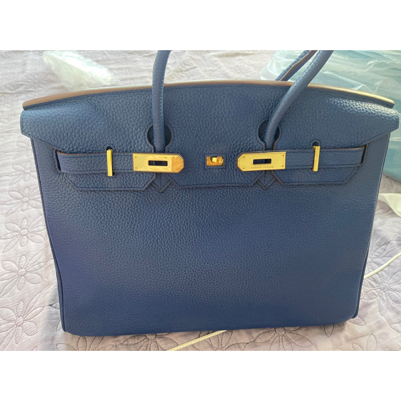 HM si hiệu da thật