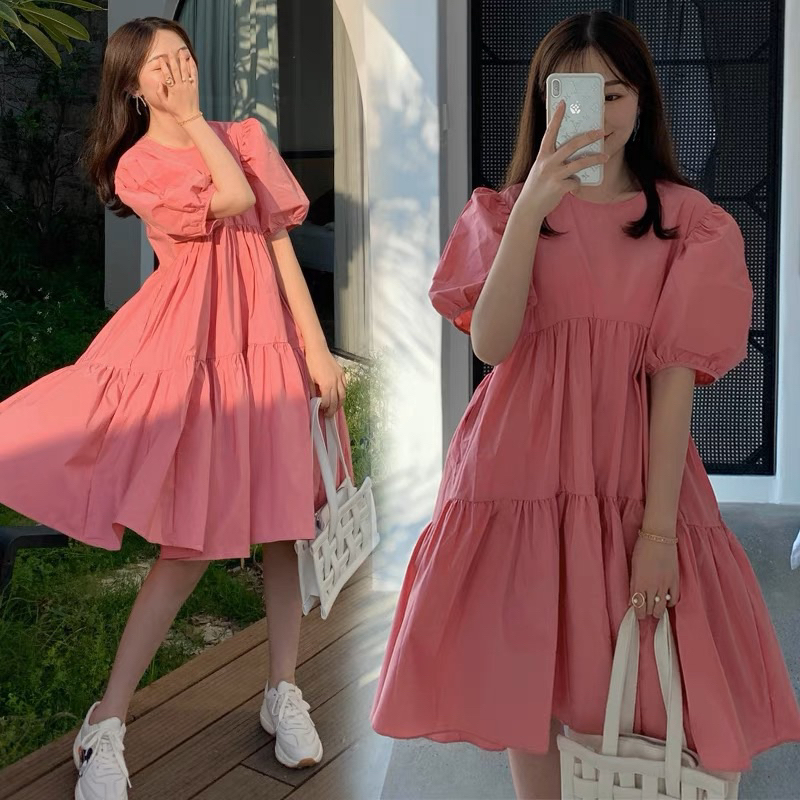 Đầm babydoll hồng dễ thương dạo phố du lịch