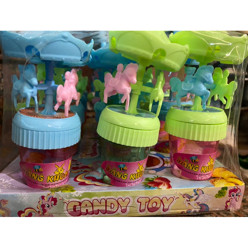 Vỉ 12 lọ kẹo xê kèm đồ chơi xích đu có đèn phát sáng