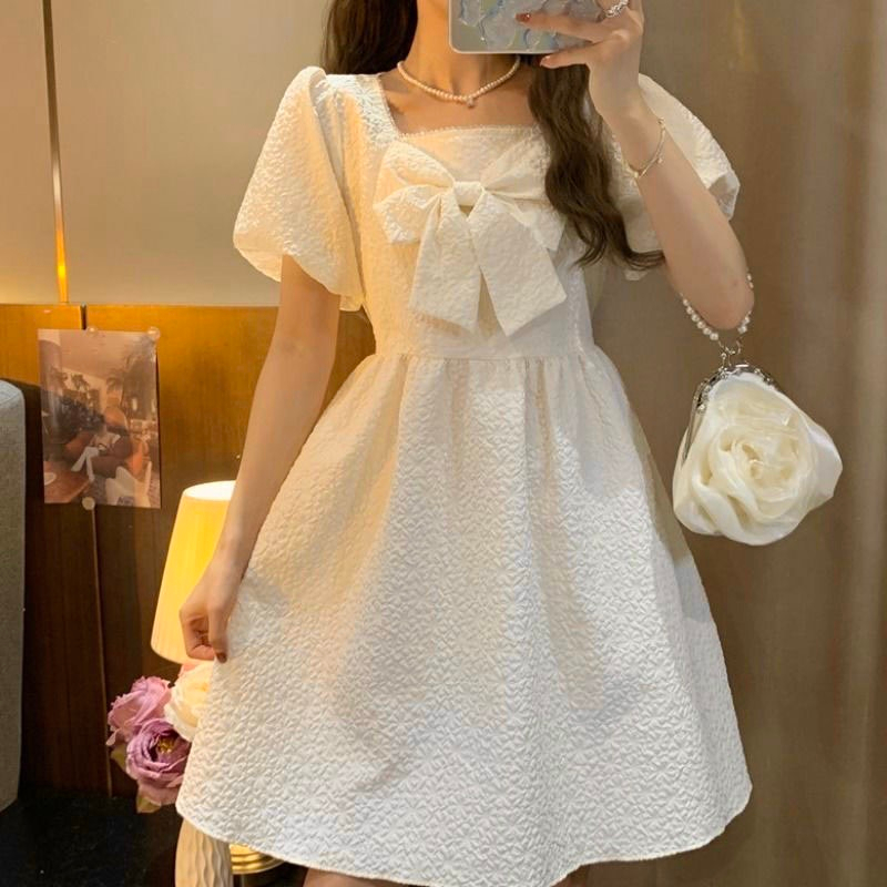 Váy Babydoll Gấm Xốp Nơ Ngực Dáng Xòe Màu Kem