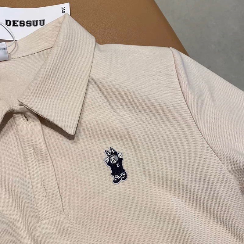 Váy polo xếp li thêu gấu