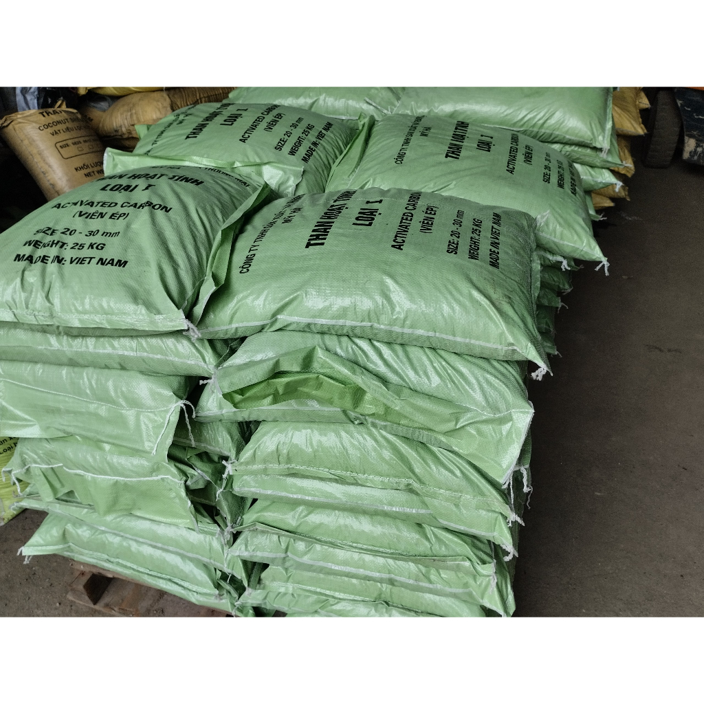 Than hoạt tính viên ép loại 1 bao 25kg .