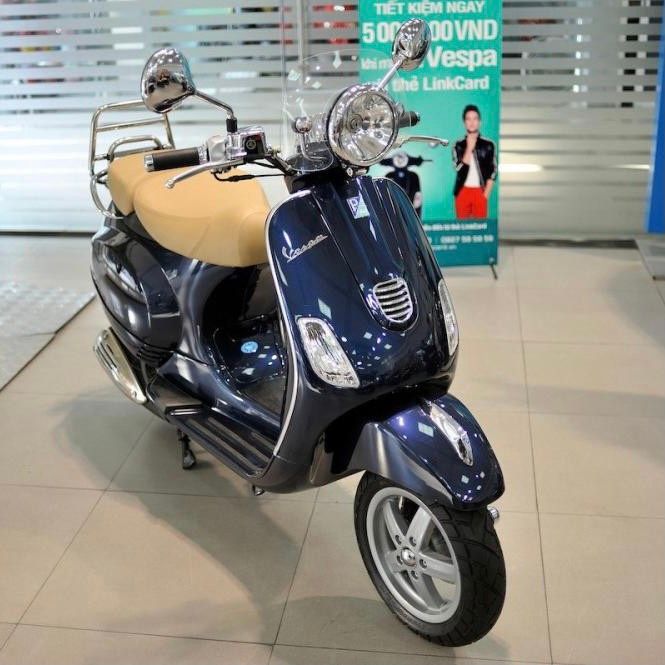Gáo đèn pha Vespa LXV