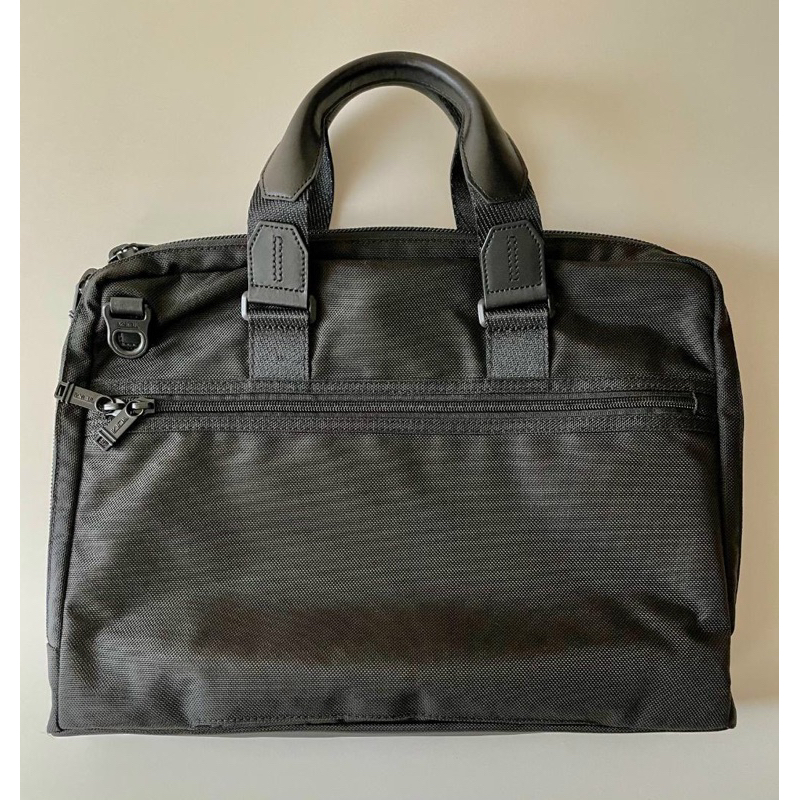 Cặp Tumi da thật phối vải