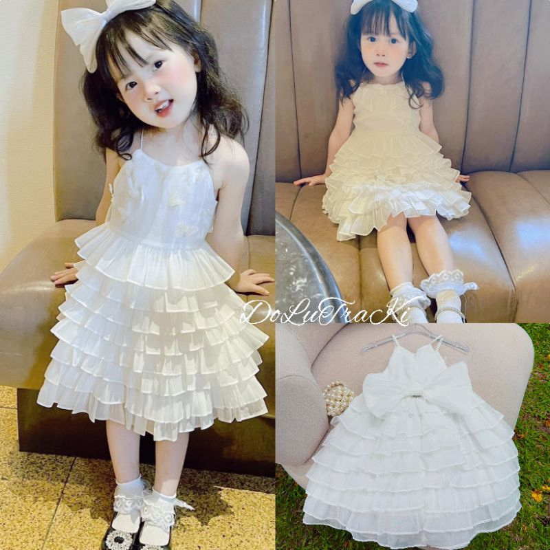 Váy (8_30kg) tầng đính bươm nổi nơ sau xinh xắn bé gái