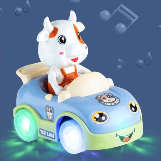 Đồ chơi bò sữa lái xe hoạt hình dễ thương,phát đèn và nhạc vui nhộn