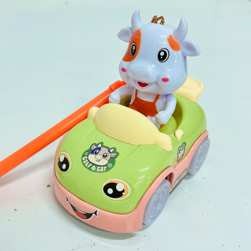 Đồ chơi bò sữa lái xe hoạt hình dễ thương,phát đèn và nhạc vui nhộn