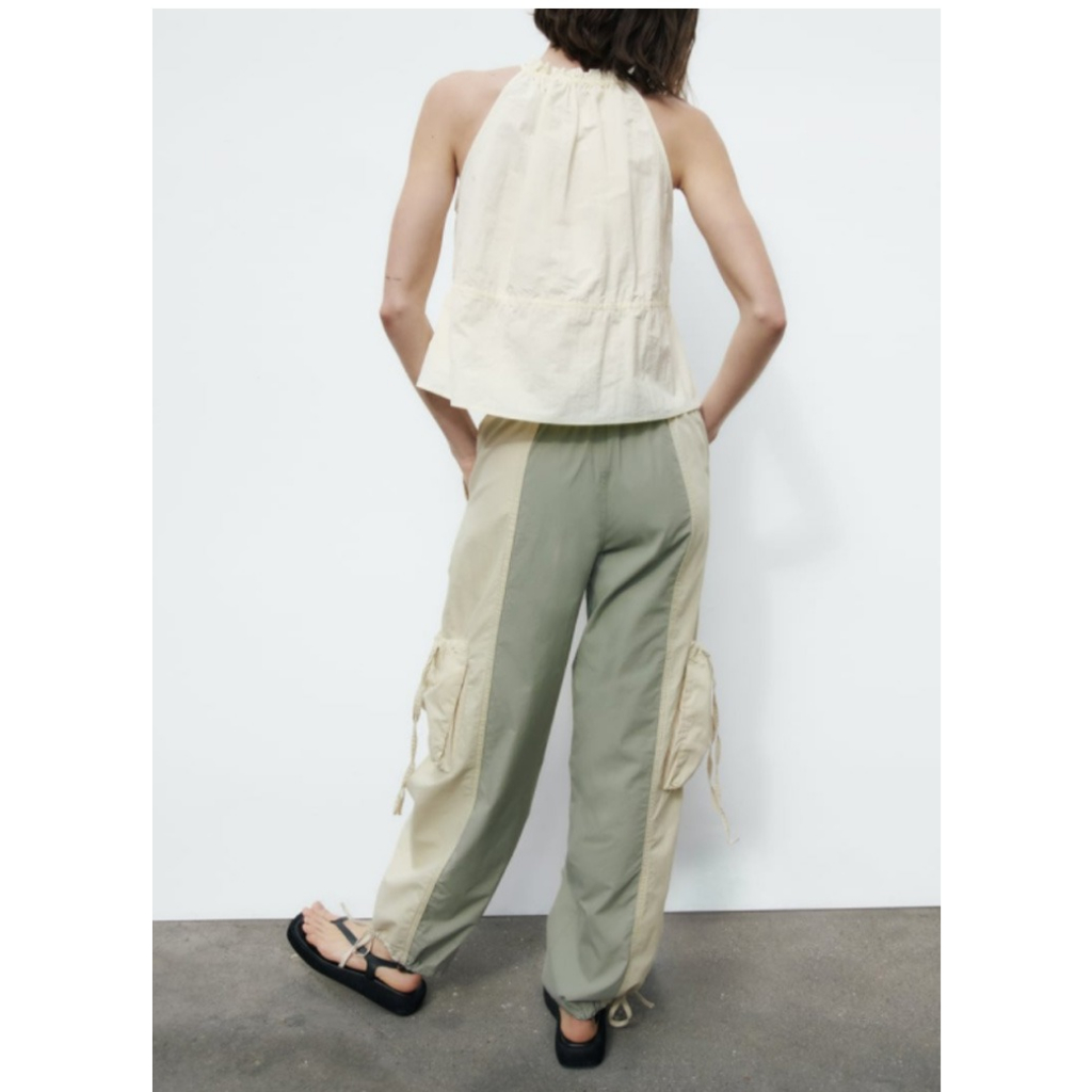 ÁO YẾM ZARA XUẤT TUỒN VẢI NYLON CÓ DÂY RÚT MÀU KEM - 7385/007