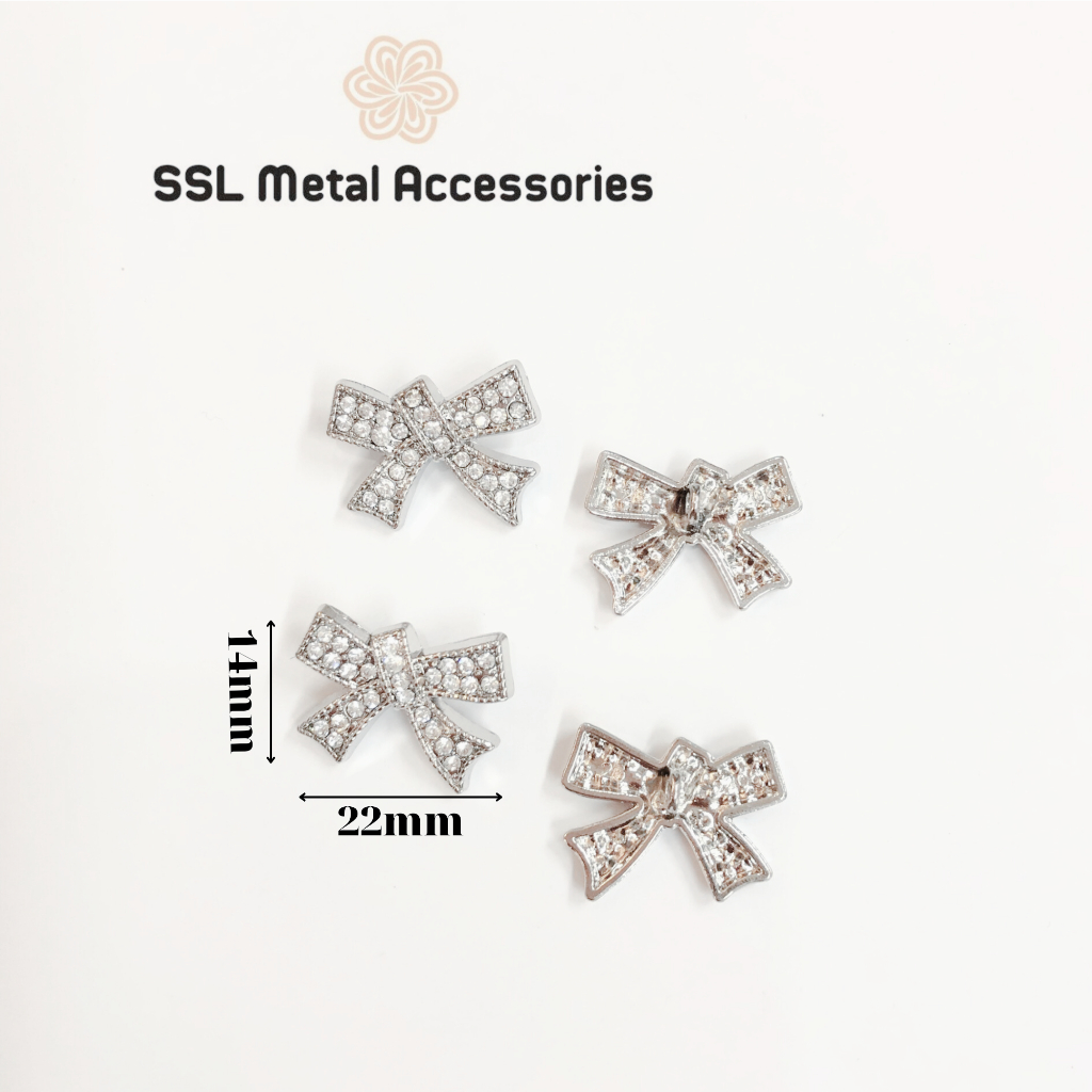 Nút áo kim loại hình nơ đính hạt thời trang mới dùng cho đầm, áo vest,... JLZ-690 14*22mm