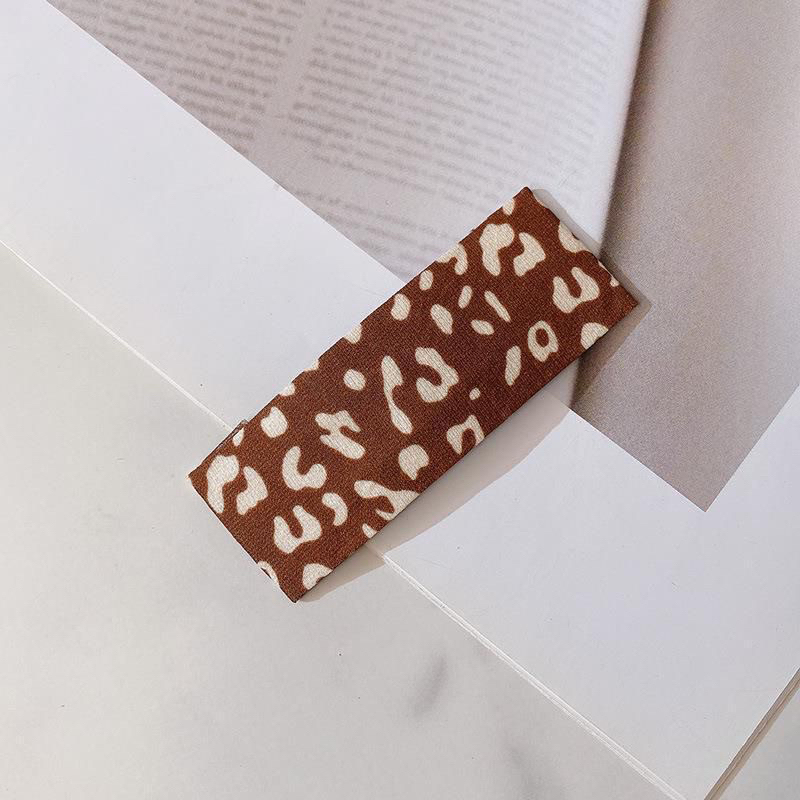 Kẹp tóc mái bọc vải họa tiết da beo, chấm bi màu trà sữa