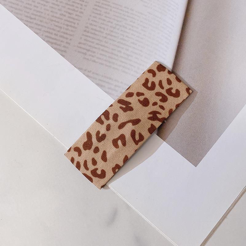 Kẹp tóc mái bọc vải họa tiết da beo, chấm bi màu trà sữa