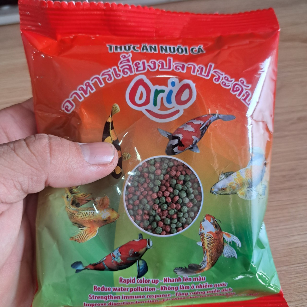 Cám cá 7 màu cá koi Bifood  Orio viên nhỏ 1 ly giúp cá lên màu đẹp, không làm đục nước túi 100gr