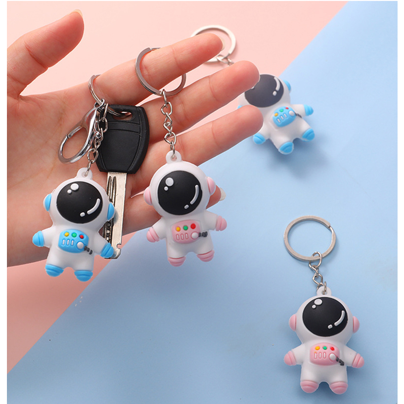 Móc khóa phi hành gia màu xanh và hồng