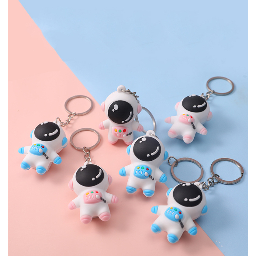 Móc khóa phi hành gia màu xanh và hồng