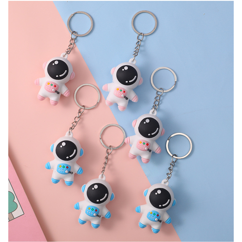 Móc khóa phi hành gia màu xanh và hồng