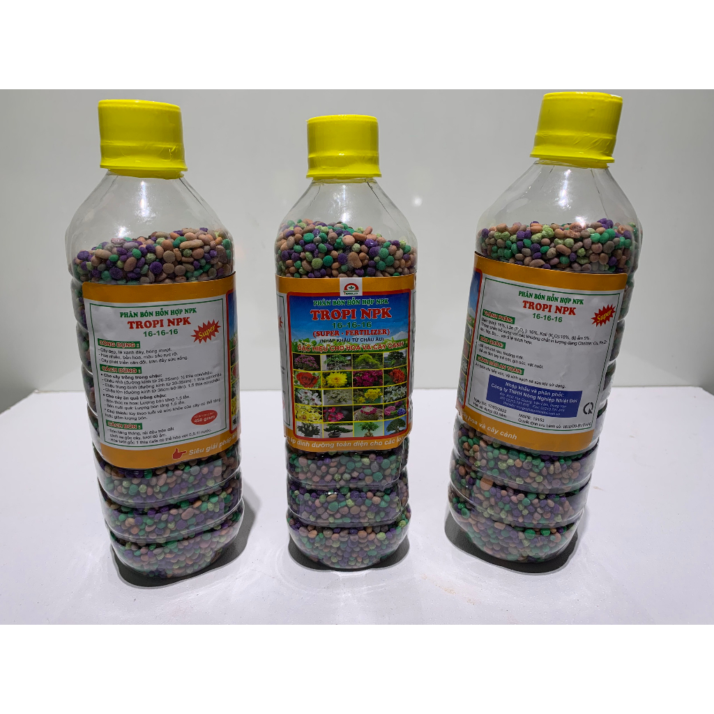 Phân tan chậm NPK 15-15-15 chai 4 màu chuyên dùng cho kiểng lá - cây ăn quả rau màu hoa cây cảnh