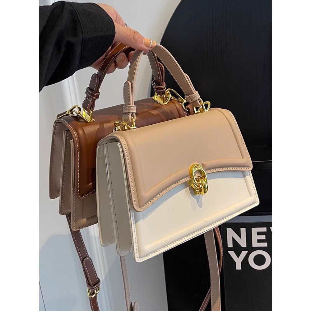 Túi xách da nữ, dây dài đeo chéo, khóa tròn nổi bật SL102