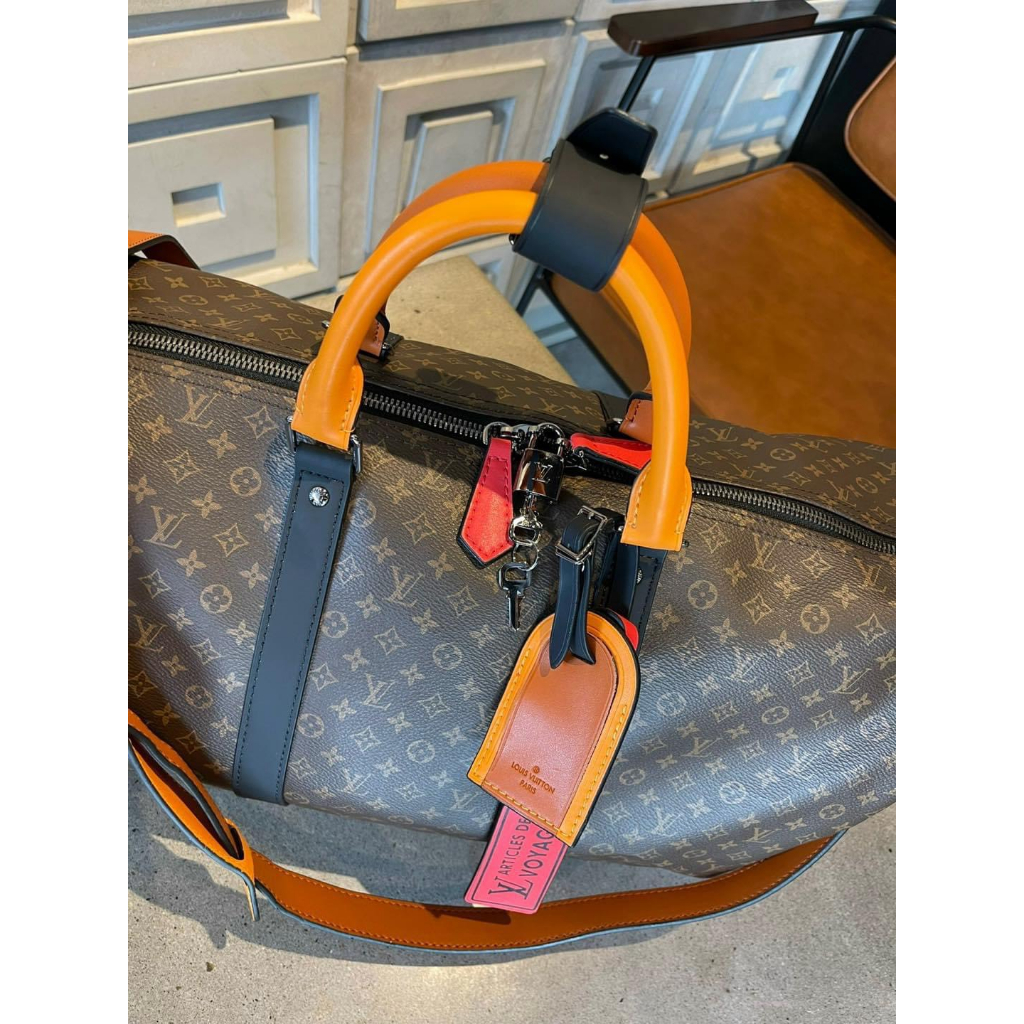 Túi du lịch Louis Vuitton Da bò cao cấp