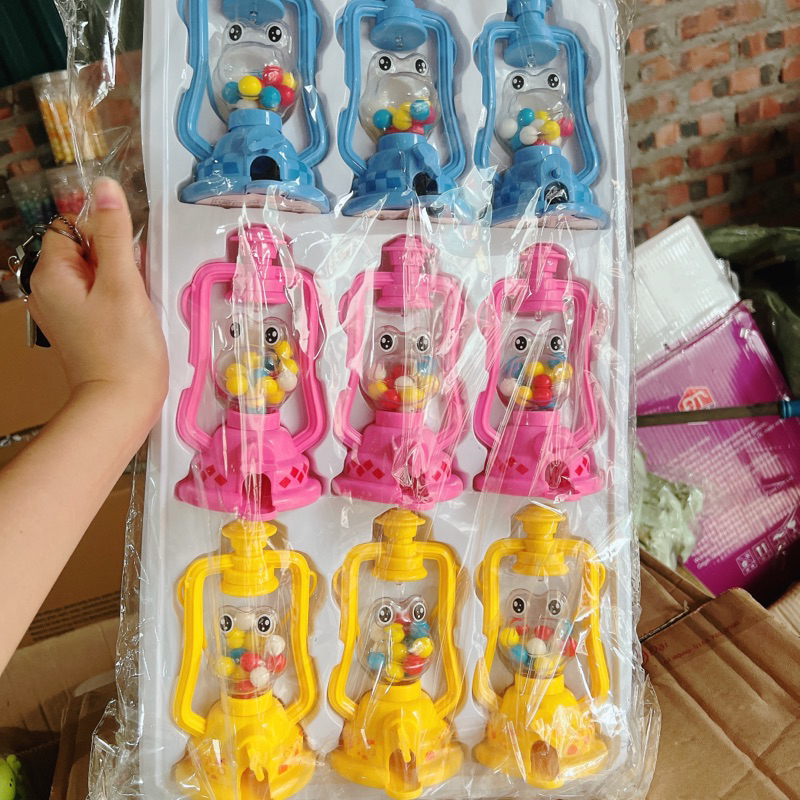sỉ vỉ 9 máy bắn kẹo hình đèn dầu phát sáng to