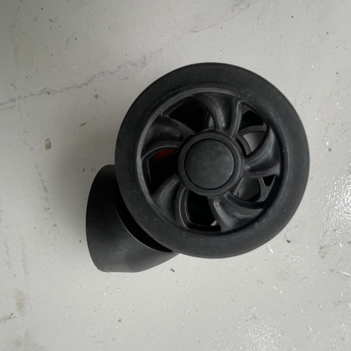 Bánh xe thay thế có chốt tháo màu đỏ dành cho Vali khung nhôm khóa sập