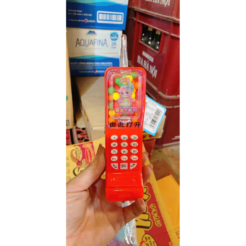 Hộp 12 chiếc điện thoai kèm kẹo xê trái cây có nhạc và đèn