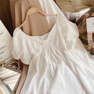 Đầm trắng babydoll nơ ngực tay bồng
