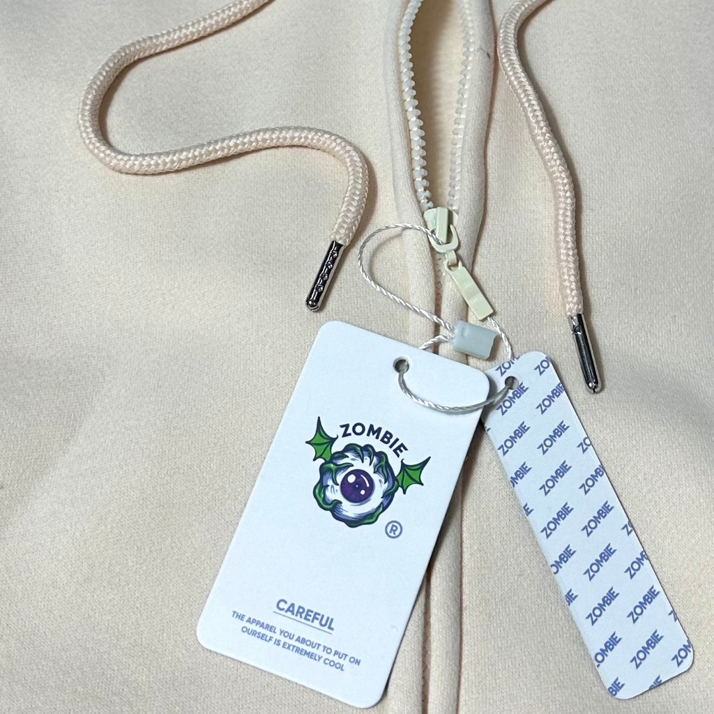 Áo hoodie zip Zombie Club x PAMIN Logo SS2 màu kem HZB12