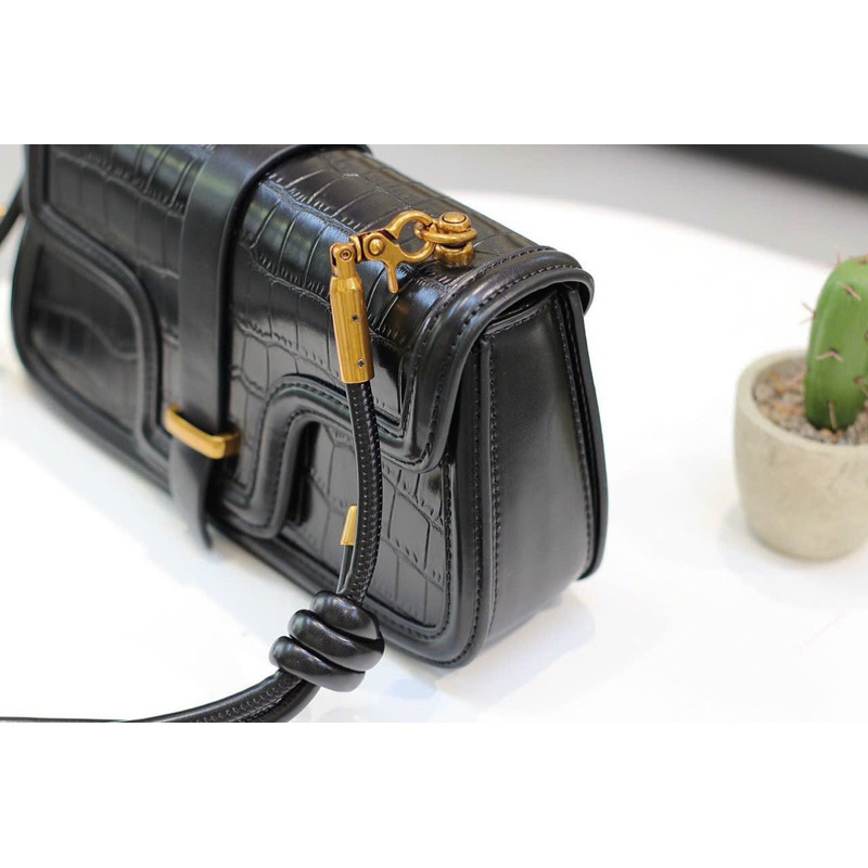 Túi xách nữ đeo chéo chất liệu da vân bóng màu đen