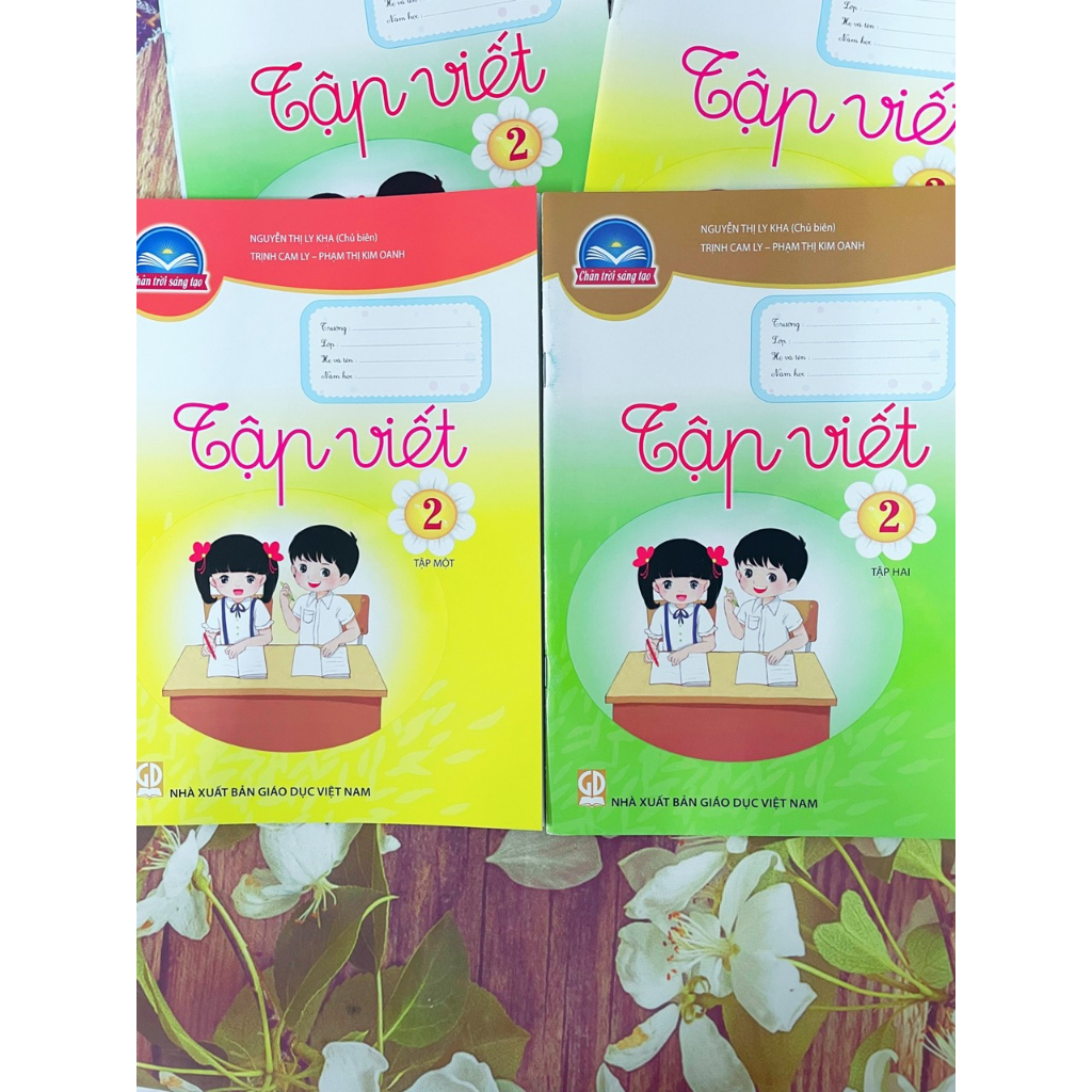 Tập Viết lớp 2 tập 1 và bao kiếng, tem nhãn
