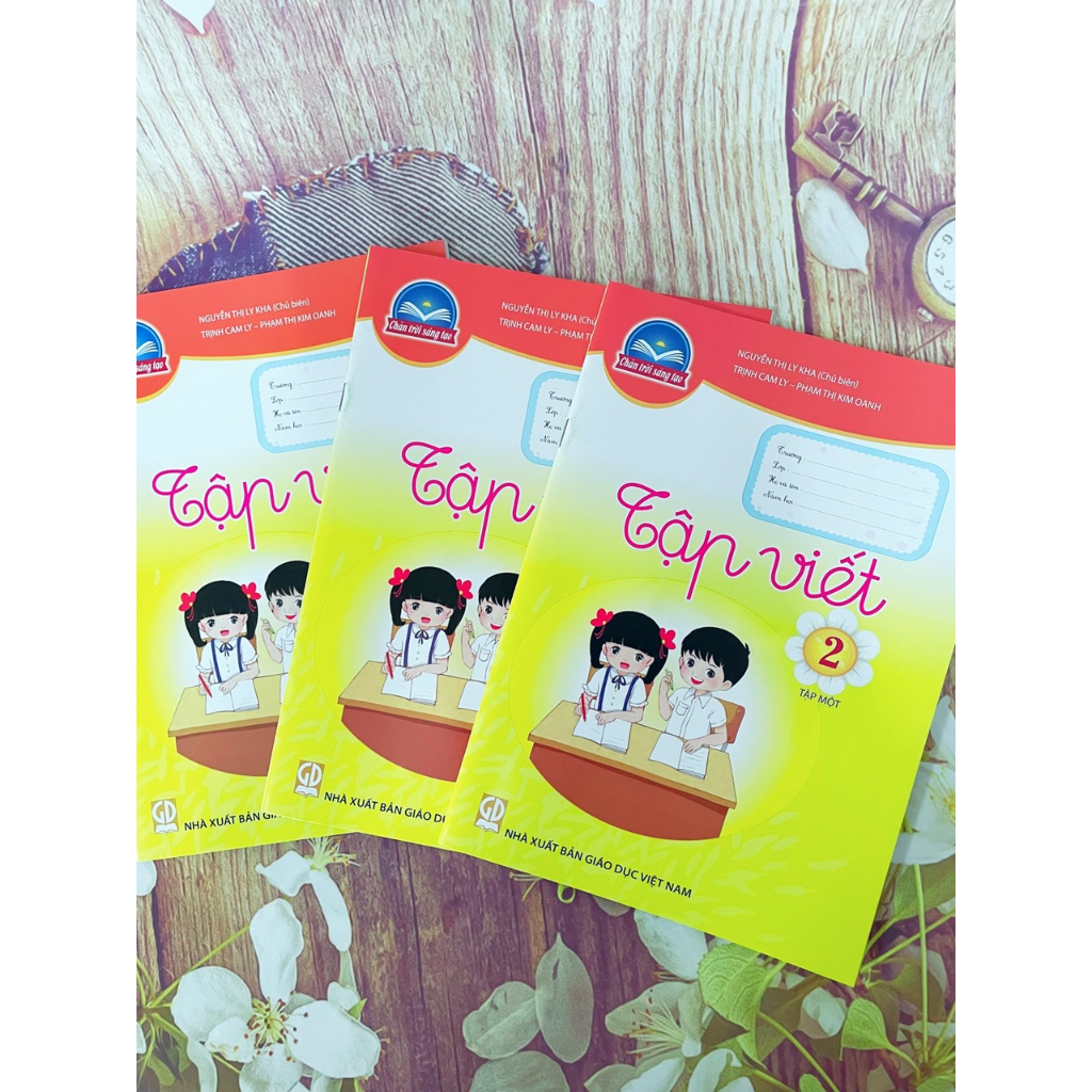 Tập Viết lớp 2 tập 1 và bao kiếng, tem nhãn